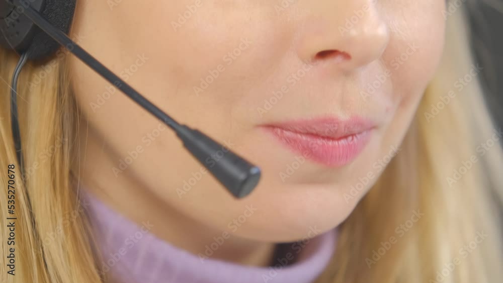 Call center operator in headset talking to client. Online support specialist speaking with customer Call center operator in headset talking to client. Online support specialist speaking with customer