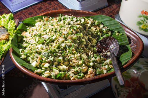 ( Trancam or Terancam ) is a typical food of Central Java, vegetables with ingredients that are not cooked only cut into pieces, stirred with grated coconut that is seasoned. photo