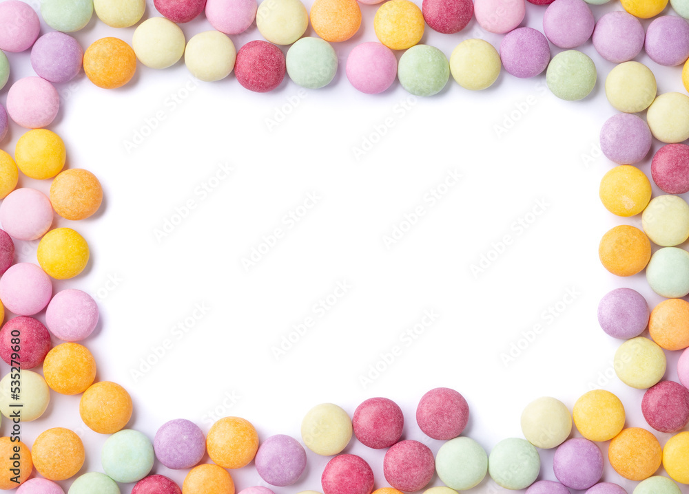 Frame of colorful candies over white background with copy space Frame of colorful candies over white background with copy space