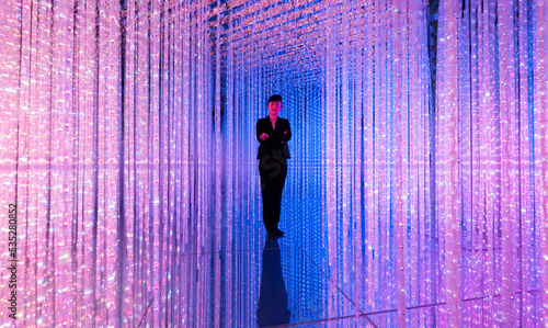 Businesswoman standing in the beautiful bokeh light