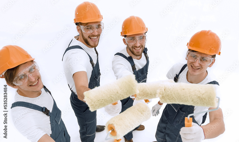 view from the top.a group of decorators with a paint roller view from the top.a group of decorators with a paint roller