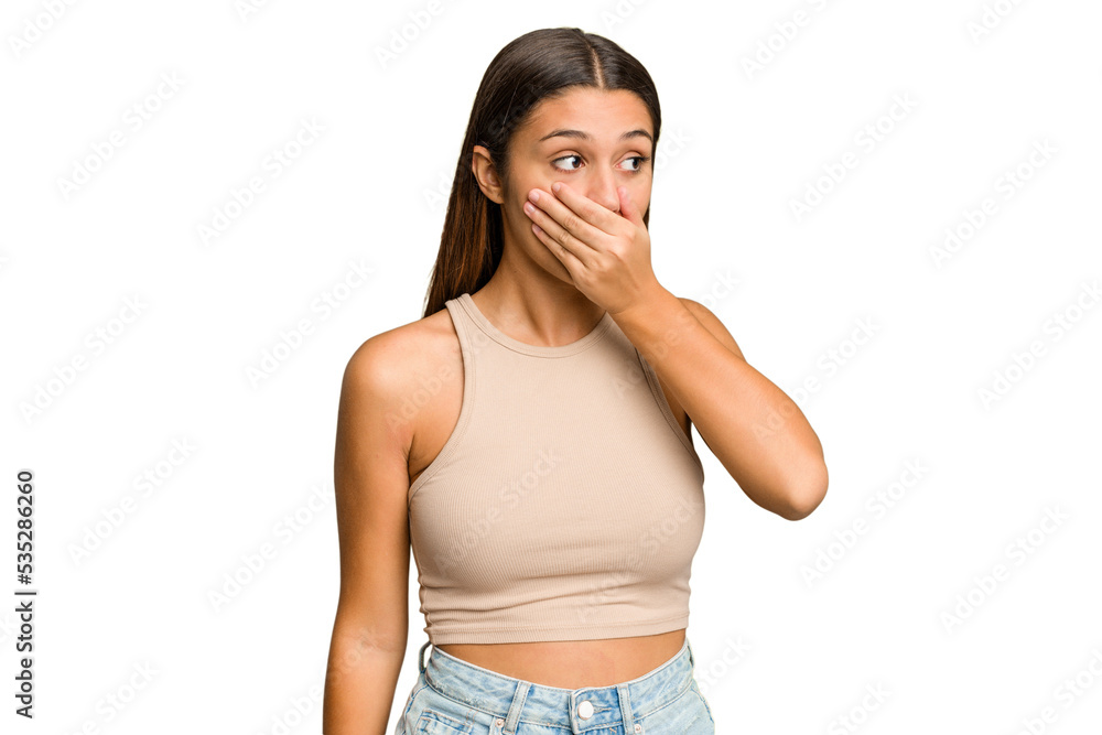 Young Indian woman isolated cutout removal background thoughtful looking to a copy space covering mouth with hand. Young Indian woman isolated cutout removal background thoughtful looking to a copy space covering mouth with hand.