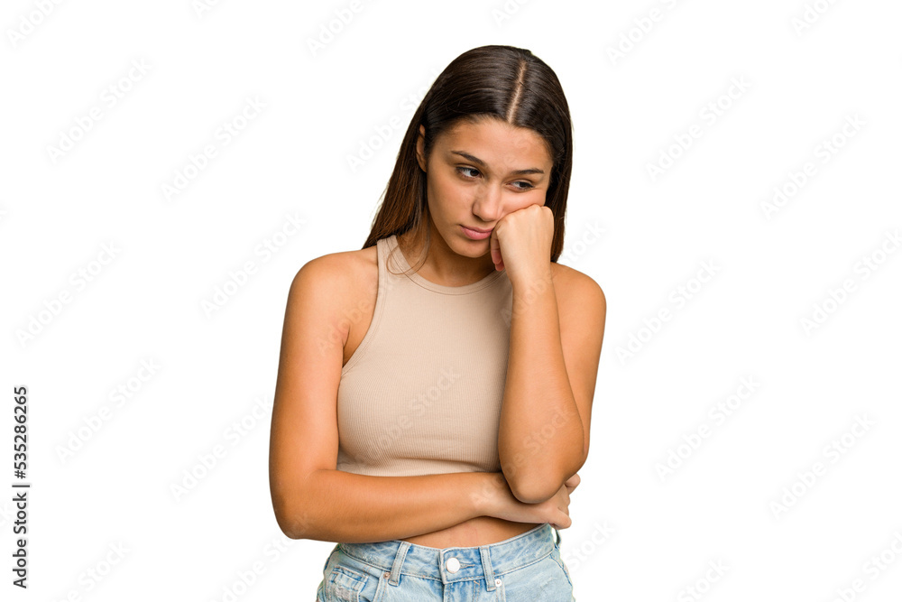 Young Indian woman isolated cutout removal background who feels sad and pensive, looking at copy space. Young Indian woman isolated cutout removal background who feels sad and pensive, looking at copy space.