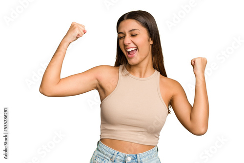 Foto Young Indian woman isolated cutout removal background raising fist after a victory, winner concept