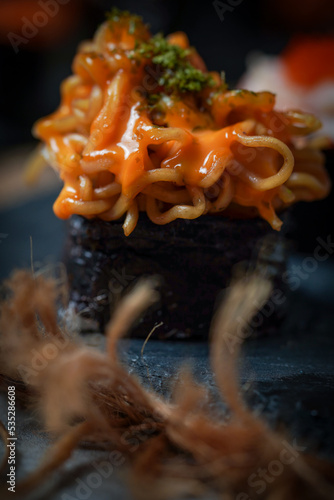 Sushi is a Japanese dish of prepared vinegared rice (鮨飯, sushi-meshi), usually with some sugar and salt, accompanied by a variety of ingredients