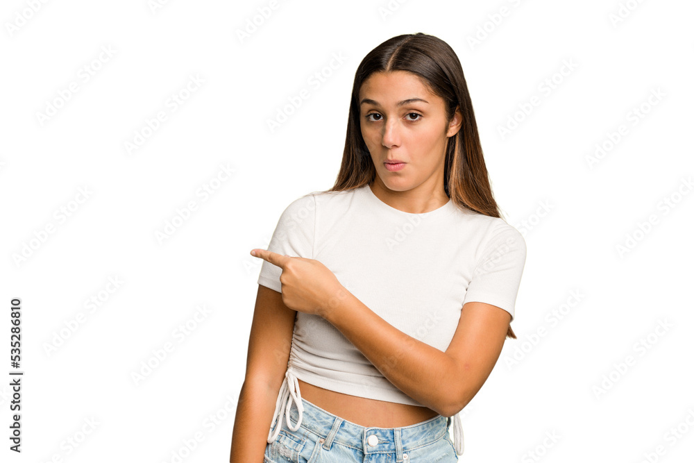 Young Indian woman isolated cutout removal background smiling and pointing aside, showing something at blank space. Young Indian woman isolated cutout removal background smiling and pointing aside, showing something at blank space.