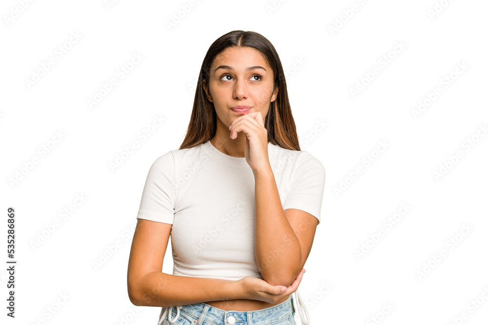 Young Indian woman isolated cutout removal background relaxed thinking about something looking at a copy space. Young Indian woman isolated cutout removal background relaxed thinking about something looking at a copy space.