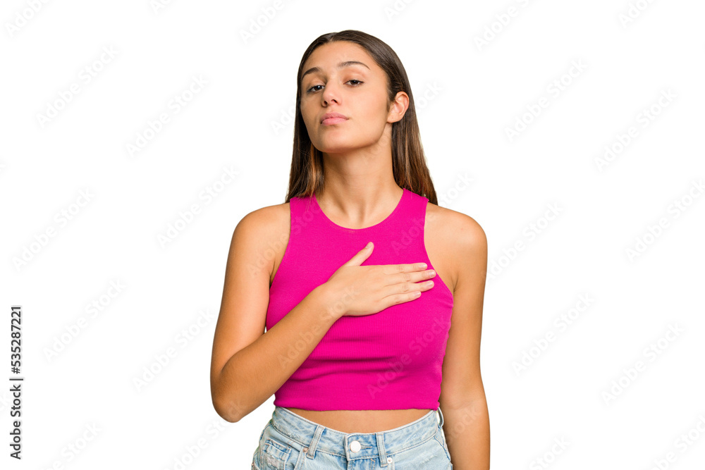 Young Indian woman isolated cutout removal background taking an oath, putting hand on chest. Young Indian woman isolated cutout removal background taking an oath, putting hand on chest.