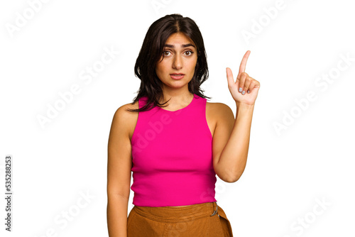 Young Indian woman isolated on green chroma background having some great idea, concept of creativity.