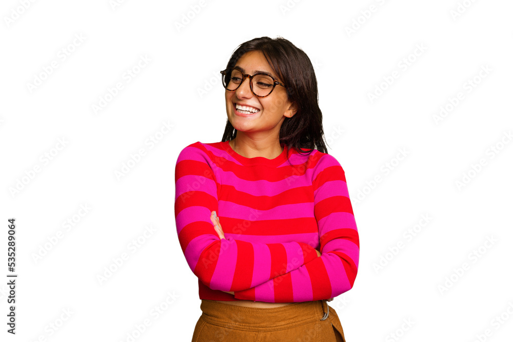 Young Indian woman isolated on green chroma background smiling confident with crossed arms. Young Indian woman isolated on green chroma background smiling confident with crossed arms.