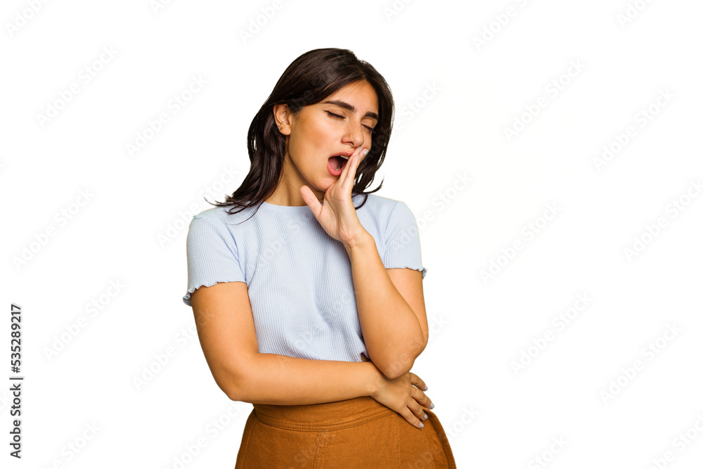 Young Indian woman isolated on green chroma background yawning showing a tired gesture covering mouth with hand. Young Indian woman isolated on green chroma background yawning showing a tired gesture covering mouth with hand.