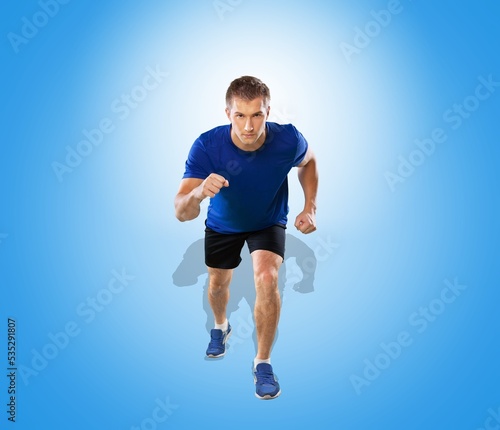 Athletic male runner on the start. Sports concept.