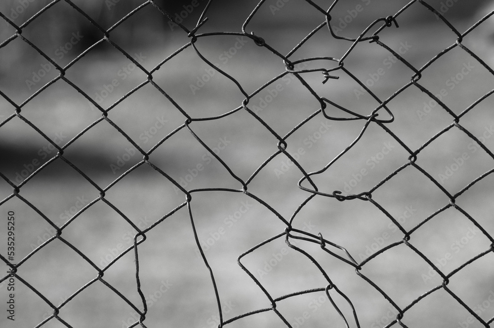 gray background, in the photo a metal mesh on a gray background gray background, in the photo a metal mesh on a gray background