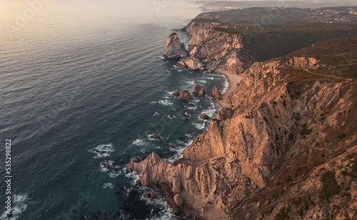 Rough cliffs near waving sea