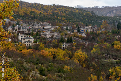 View of traditional architecture with    stone buildings  during  fall season in Monodendri village, zagori Greece photo