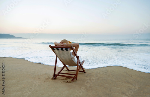Young woman relaxing on the beach.