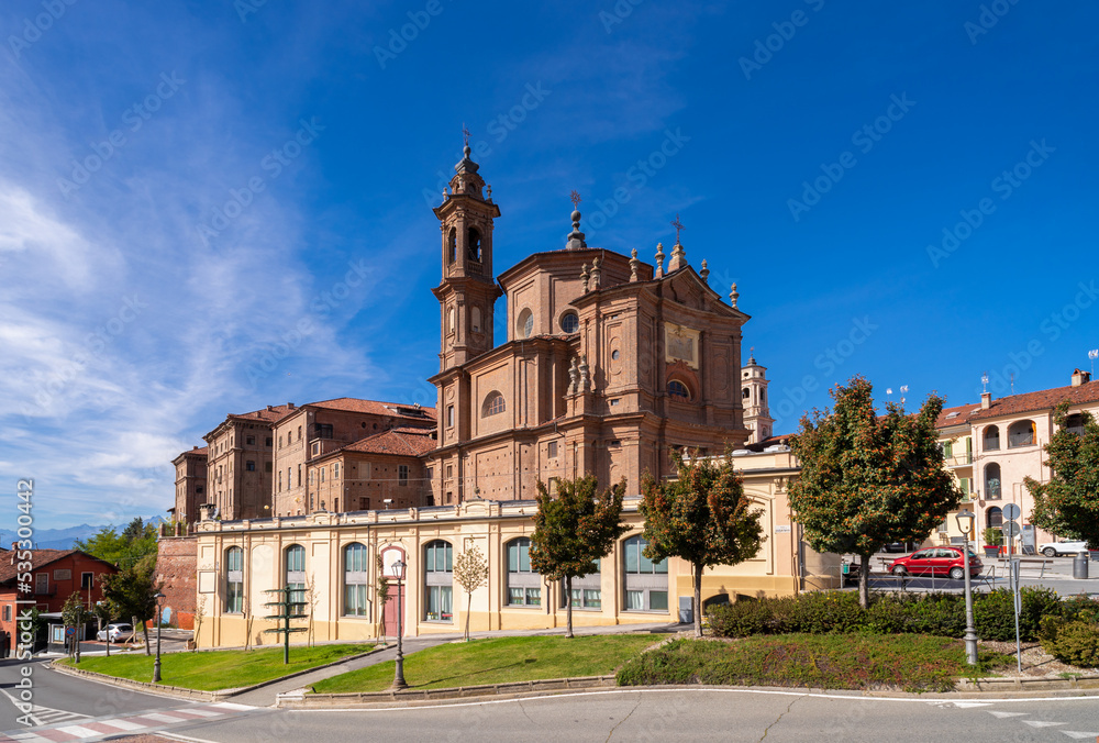 Fossano, Cuneo, Piedmont, Italy - October 03, 2022: The church of the Holy Trinity or Battuti Rossi (beaten reds) with the hospital building of the holy trinity