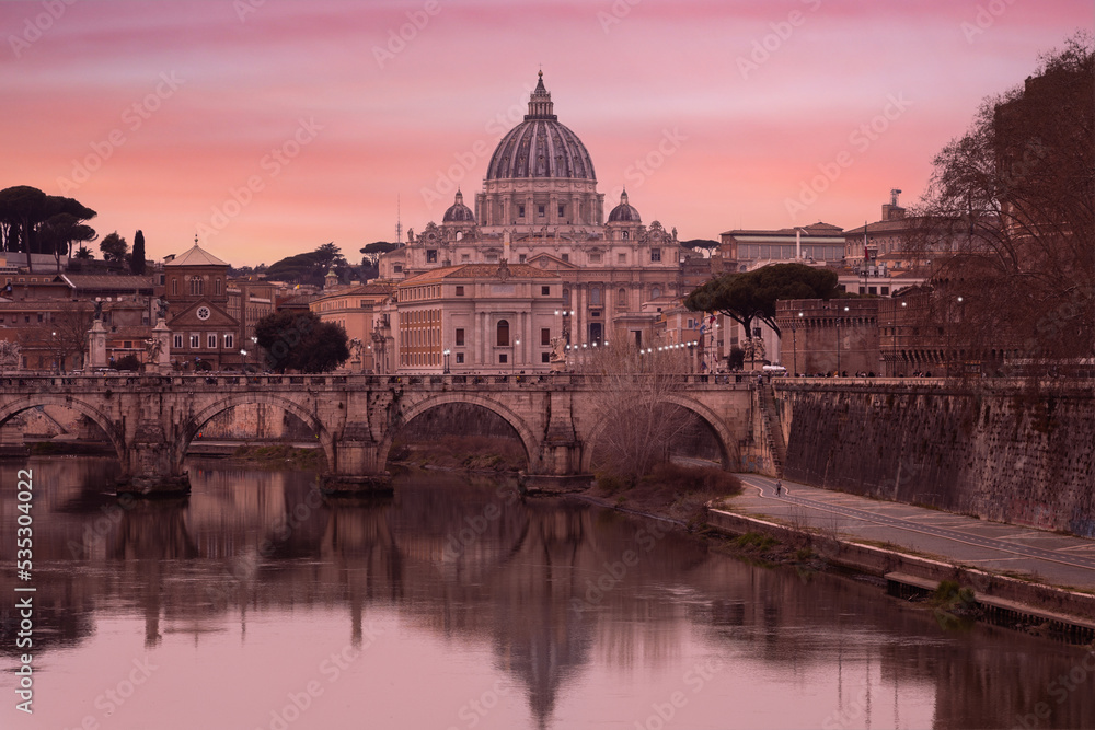Lovely view of St Peter's Basilica (San Pietro) in Vatican City, Italy, Europe, at sunset. It is a famous landmark of Vatican. Nice cityscape of the old Roma in winter 