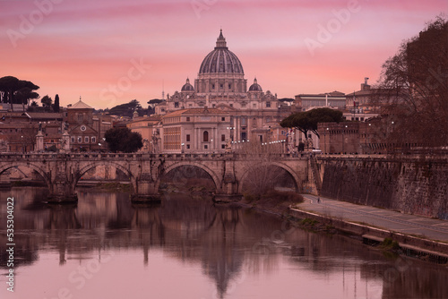 Lovely view of St Peter's Basilica (San Pietro) in Vatican City, Italy, Europe, at sunset. It is a famous landmark of Vatican. Nice cityscape of the old Roma in winter 