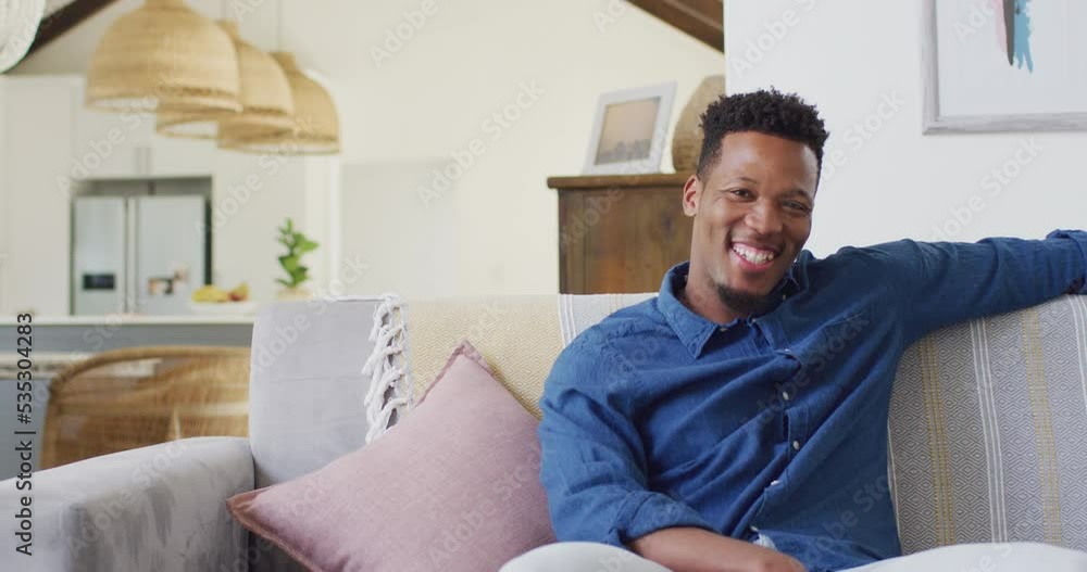 Portrait of african american man smiling in living room Portrait of african american man smiling in living room