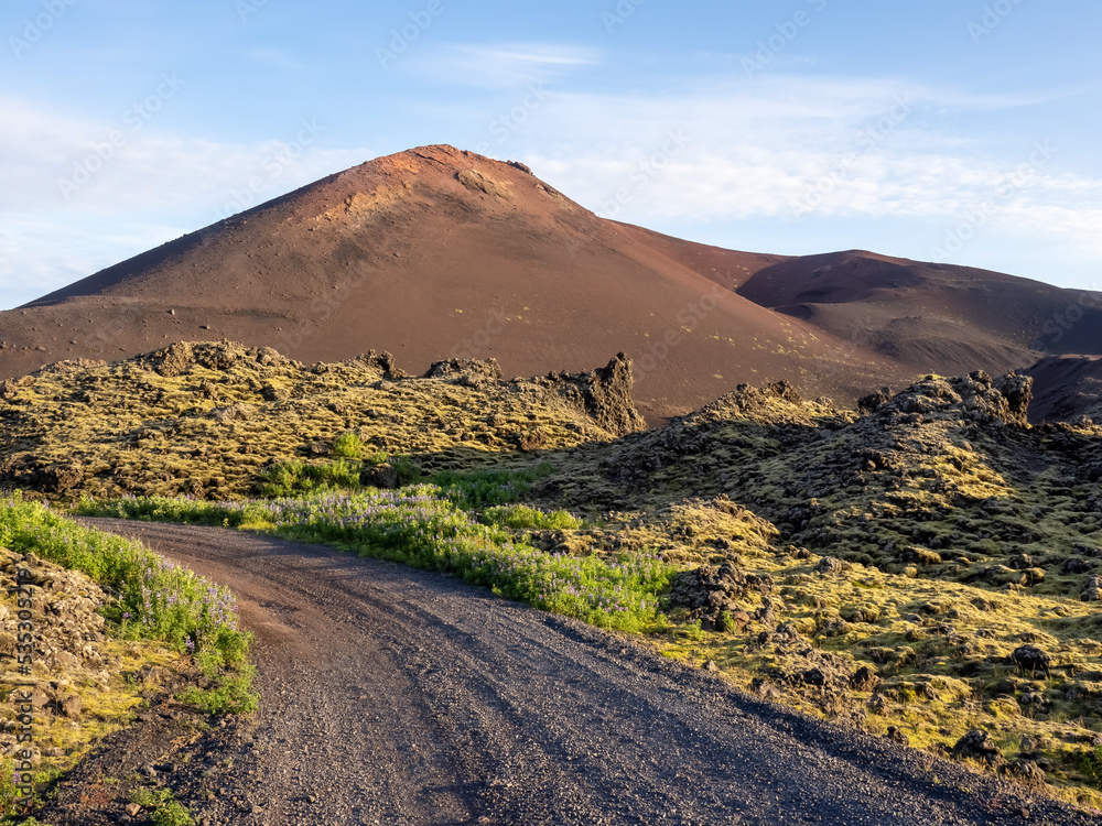 Lava fields road to the Eldfell volcano, Heimaey, Vestmannaeyjar islands, Iceland. Its 1973 eruption caused major destruction and increased the area of the island significantly.
