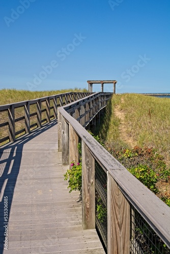 Boardwalk across sand dunes towards Atlantic Ocean beach at Plum Island © JohnBlottman