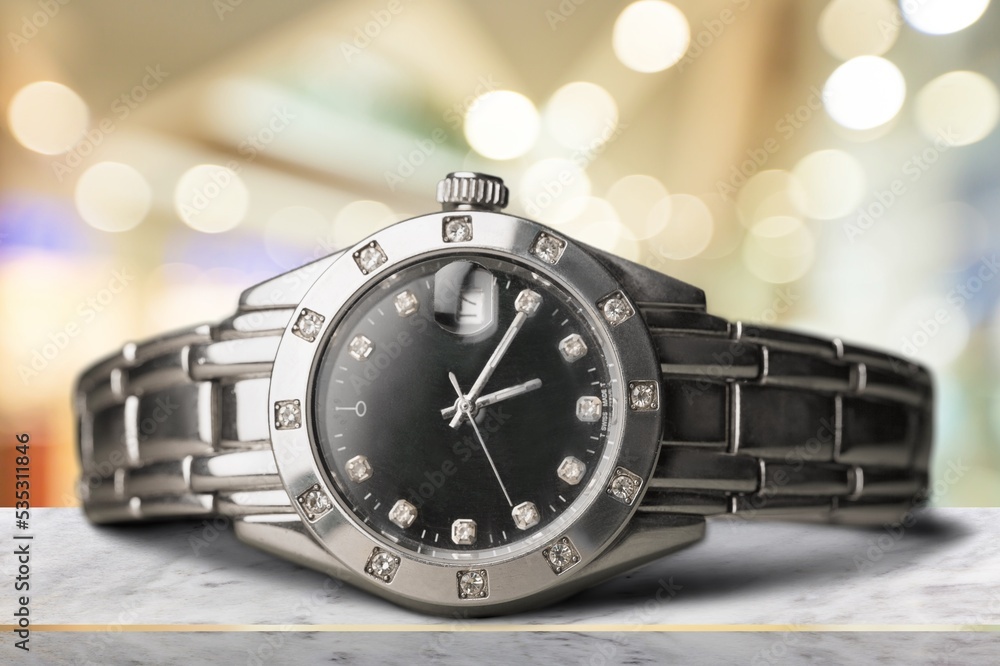 Beautiful modern stylish Wristwatch on the desk Beautiful modern stylish Wristwatch on the desk