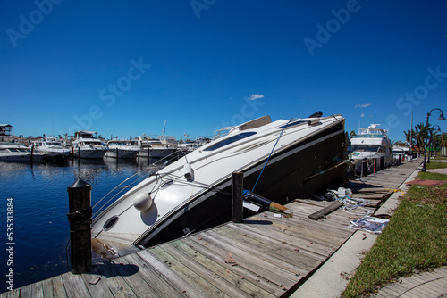 The boat pushed up on dock by Hurrican Ian storm surge