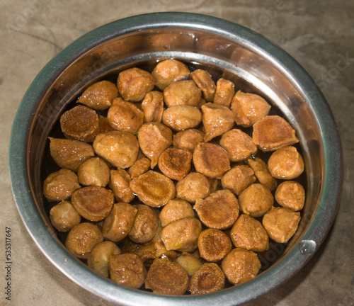 roasted and soaked yellow moong vadi or urad warian in water. photo