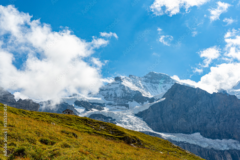 Panorama view of Eiger, Mönch and Jungfrau in summer. Summer holidays in Europe.