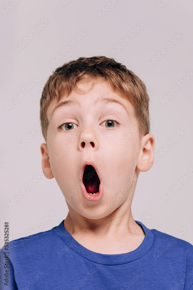Emotional portrait of boy wearing blue t-shirt, surprised Emotional portrait of boy wearing blue t-shirt, surprised