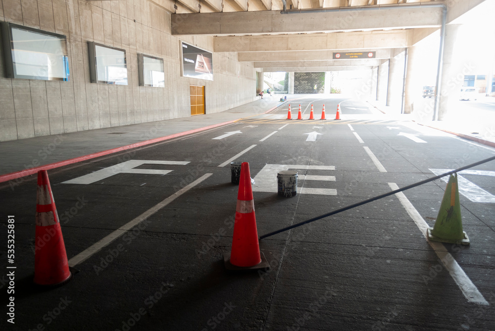 Road blockage in airport parking lot, space under asphalt repair.