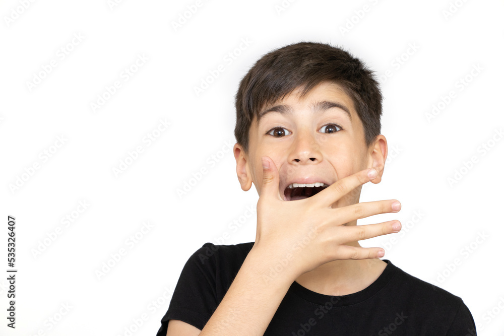 Photo of adorable young happy boy looking at camera.Isolated on the white background Photo of adorable young happy boy looking at camera.Isolated on the white background
