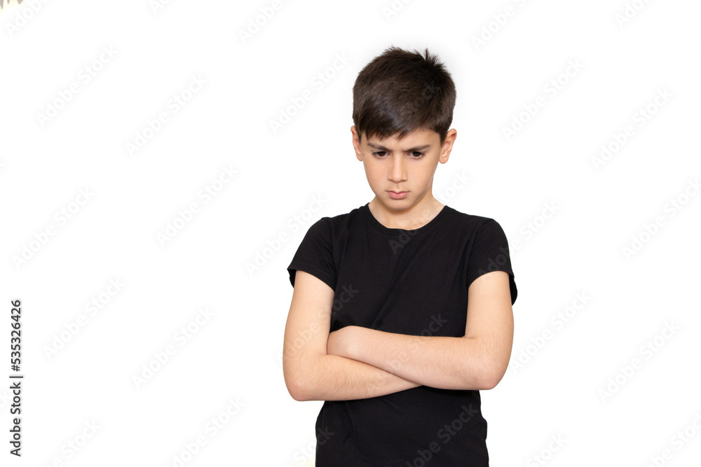 Portrait of a frowning upset little boy looking at camera isolated over white background