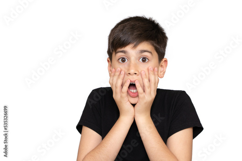 Little boy asian kid wearing casual black tshirt scared and amazed with open mouth for surprise, disbelief face. Isolated on the white background