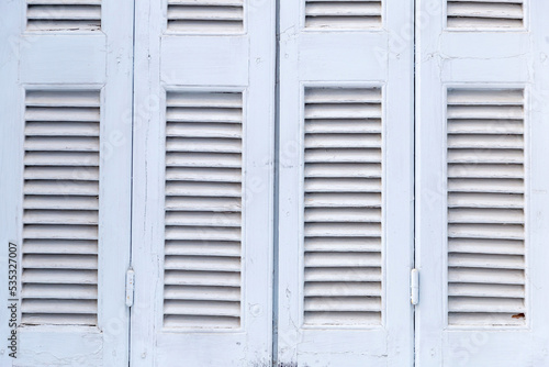 Window closed shutters background  texture. Traditional Greek island house.