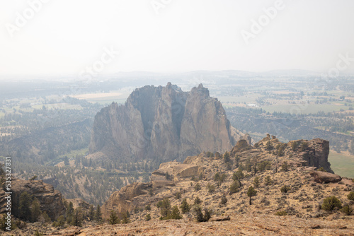 Smith Rock State Park in Central Oregon on a Hazy Summer Day with Wildfire Smoke in the Sky photo