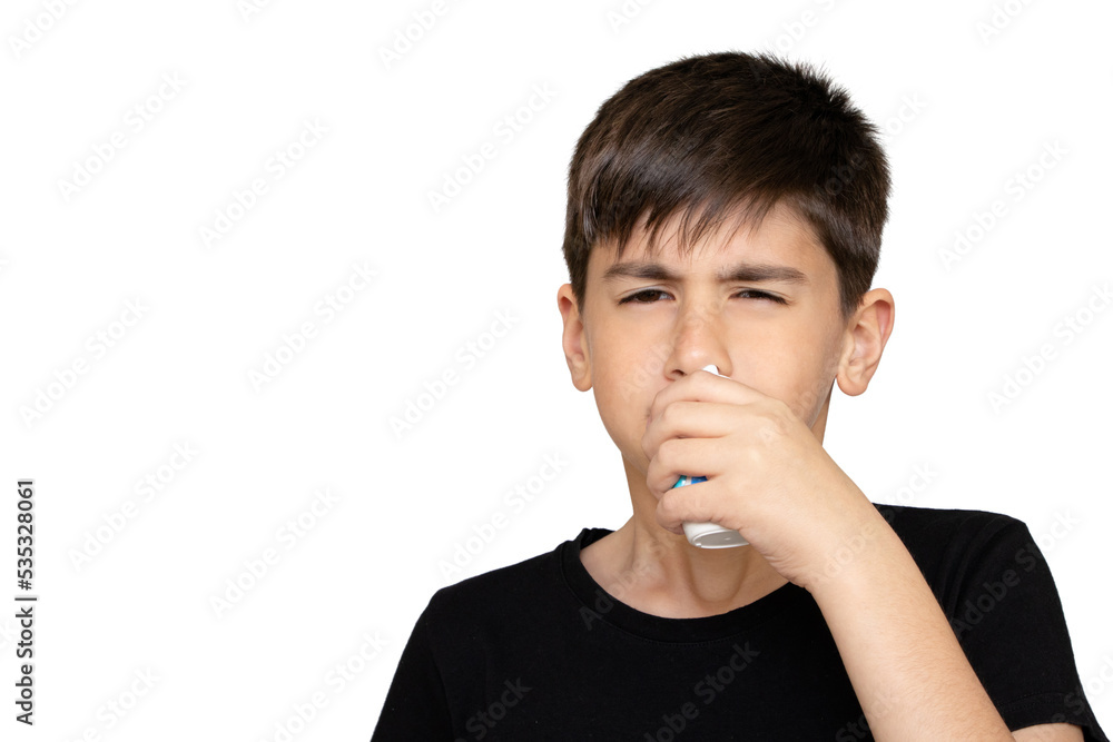 Little boy spraying medicine in nose, nose drops. Little child using nasal spray. Runny nose, cold, flu, illness, virus. Close up. Isolated on the white background Little boy spraying medicine in nose, nose drops. Little child using nasal spray. Runny nose, cold, flu, illness, virus. Close up. Isolated on the white background