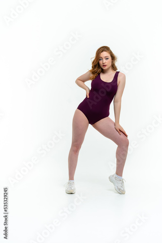 model size posing bodysuit on white background © sutulastock