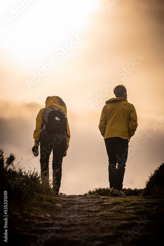Two hikers on the road