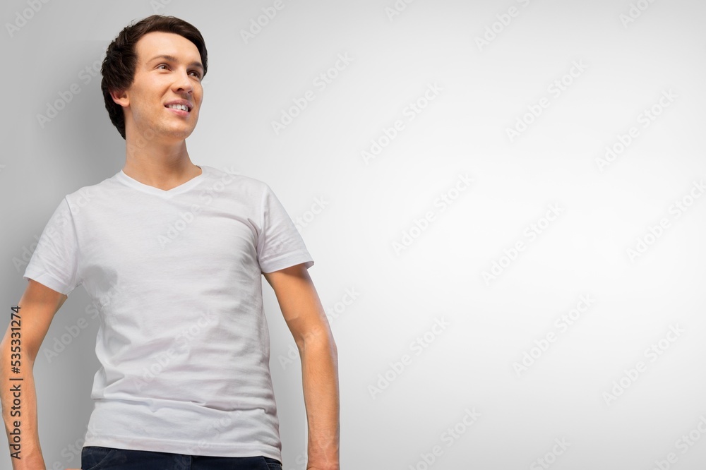 Portrait shot of young adult man smiling posturing on background Portrait shot of young adult man smiling posturing on background