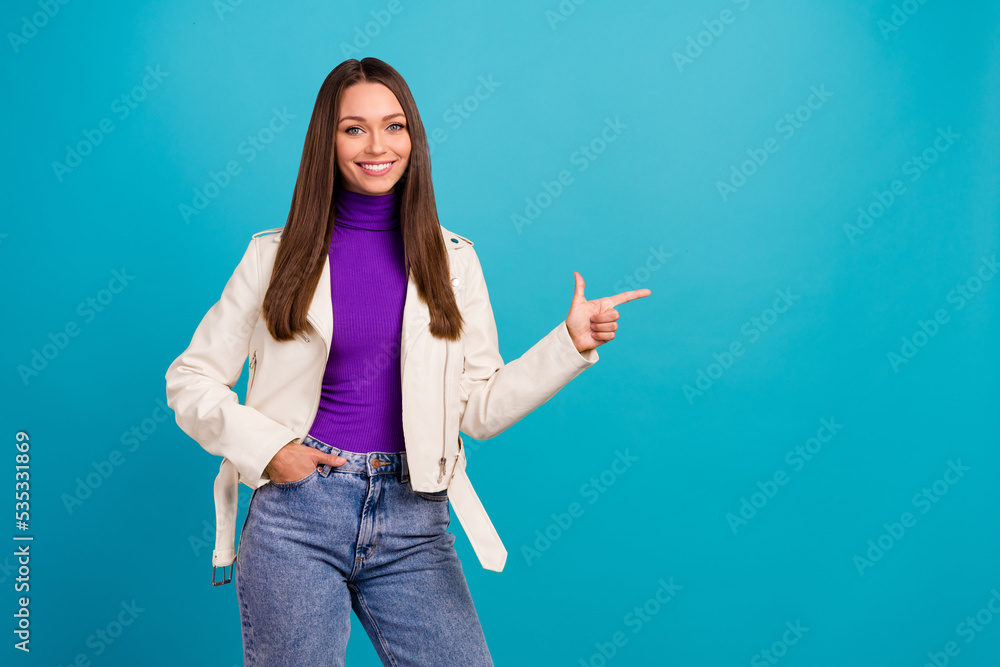 Photo of trendy lady person propose buy good quality clothes stand index finger arm empty space isolated on blue color background Photo of trendy lady person propose buy good quality clothes stand index finger arm empty space isolated on blue color background