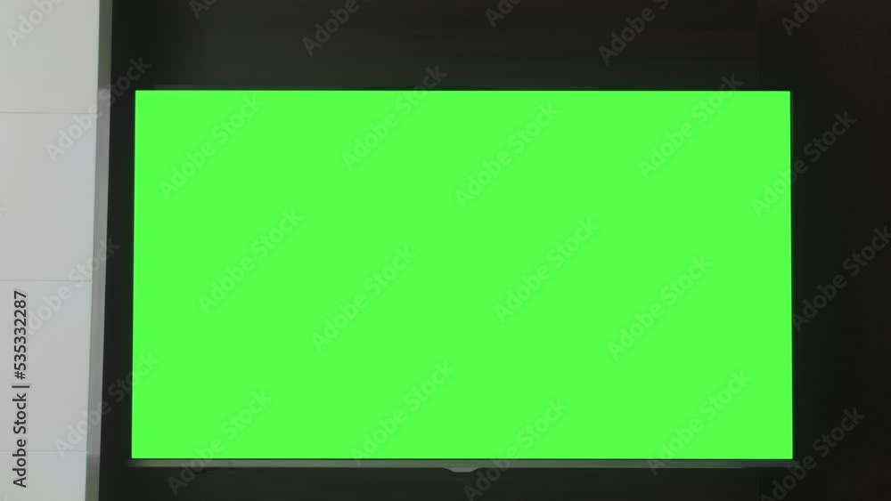 TV mockup screen. Smart TV screen with blank green screen in the living room. Stock Video