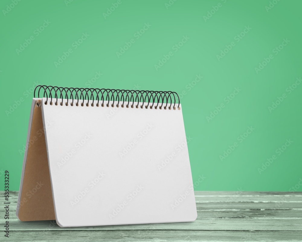 The mini 2022 desk calendar on desk background. The mini 2022 desk calendar on desk background.