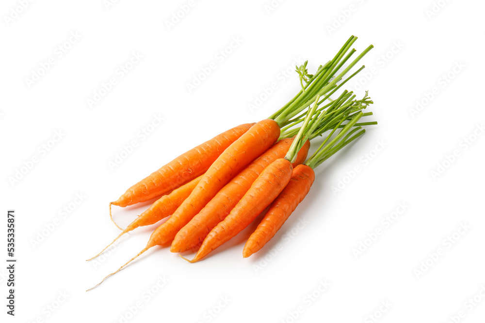 Bunch of fresh carrots with green tops isolated on white background with clipping path. Carrots cut out. Bunch of fresh carrots with green tops isolated on white background with clipping path. Carrots cut out.