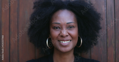 Positive African woman smiling at camera