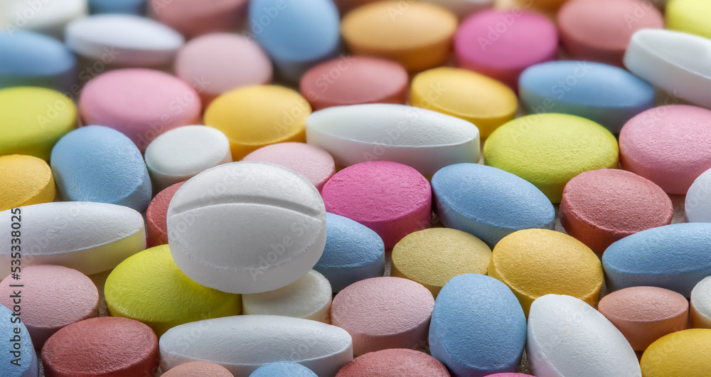 Tablets of different colors. Antibiotic resistance. Tablets from antimicrobial viruses. Pharmaceutical industry.. Tablets of different colors. Antibiotic resistance. Tablets from antimicrobial viruses. Pharmaceutical industry..