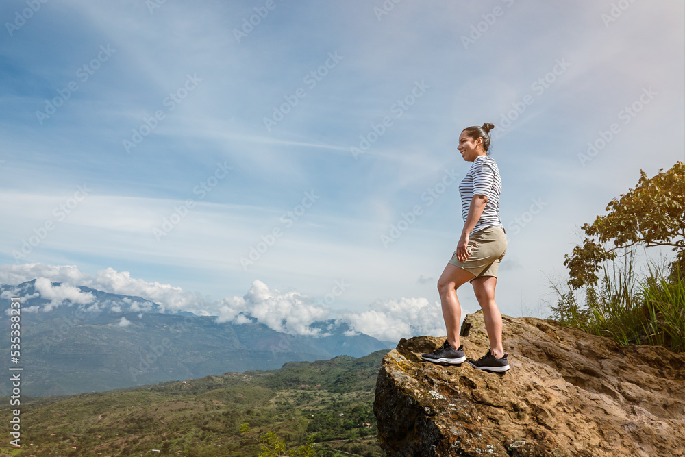 Young woman doing tourism in old town of Colombia, woman making selfie with landscapes of Barichara Young woman doing tourism in old town of Colombia, woman making selfie with landscapes of Barichara