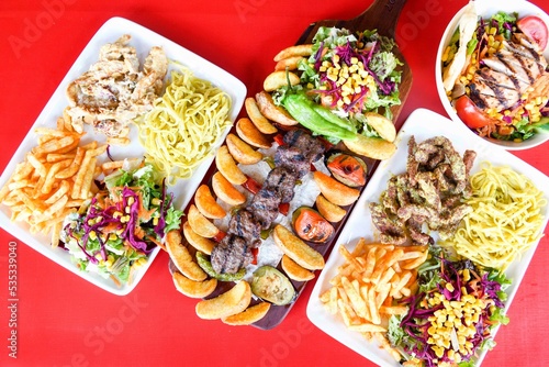 Wallpaper Mural Delicious meat kebab with fresh vegetable salad served with variety of Turkish dishes and appetizers. Top view of assorted Turkish food and meze, tasty and healthy Mediterranean cuisine. Torontodigital.ca