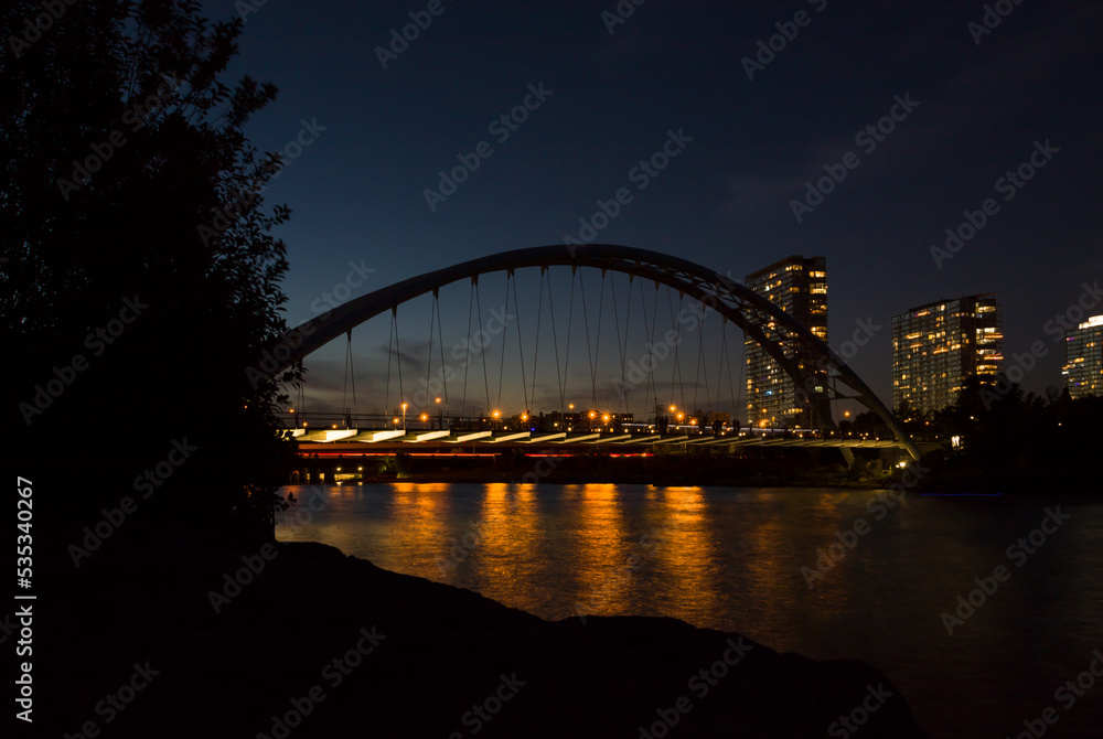 city harbor bridge - night lights and water reflection 